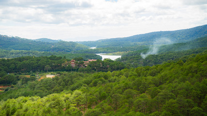 Mountain landscapes covered with forests up to the horizon in the city of Dalat in Vietnam.