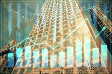 Forex chart on cityscape with tall buildings background multi exposure. Financial research concept.