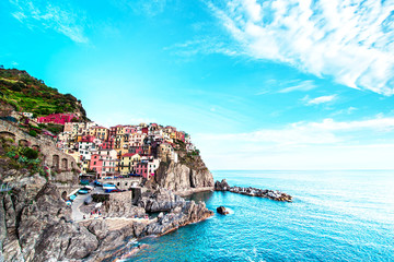 Fototapeta na wymiar Beautiful magic colorful summer landscape on the coast of Manarola in Cinque Terre, Liguria, Italy. Exotic amazing places. Popular tourist atraction.