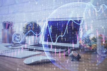Double exposure of graph and financial info and work space with computer background. Concept of international online trading.