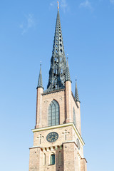 Fototapeta na wymiar Belfry of Riddarholm church is the church of a former medieval abbey in Stockholm, Sweden