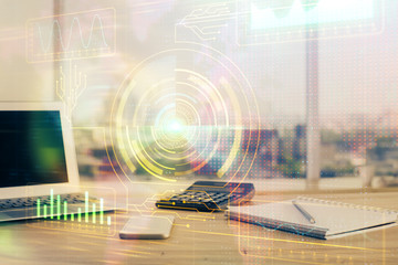 Double exposure of desktop computer and technology theme hologram. Concept of software development.