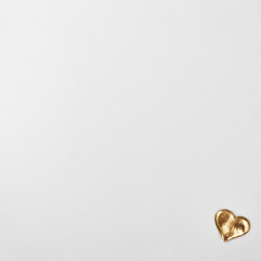 Gold heart on art cotton canvas for drawing. Love and Valentine's Day concept photo.