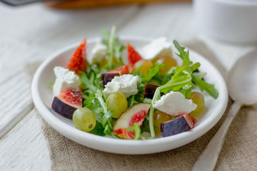 Vegetarian salad with figs and goar cheese.
