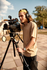 Always there. Video camera operator at work. Journalism industry, live streaming concept.