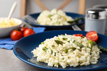 Delicious risotto with asparagus in plate, closeup