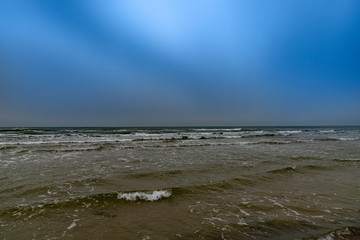 Gray Baltic sea and blue sky.