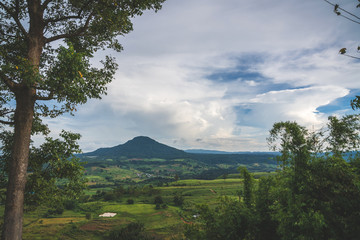 Fototapeta premium beautiful blue sky high peak mountains mist fog wildlife green forest at Khao Koh, Phu Tub Berk, Phetchabun, Thailand guiding idea long weekend for backpacker camping campfire relaxing hiking