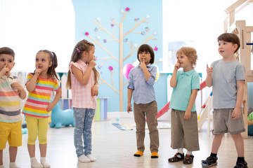 preschool children group have fun and play game on indoor classes in kindergarten