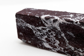 Red jasper block on a white background