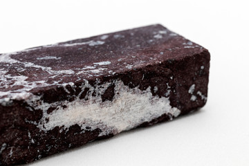 Red jasper block on a white background