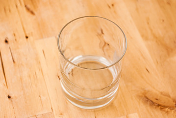 Single Glass On Wooden Table