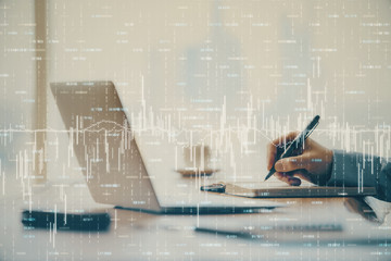 Double exposure of forex chart with man working on computer on background. Concept of market analysis.