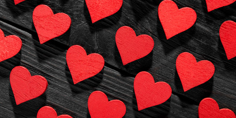 Happy Valentine's day hearts on wooden background.