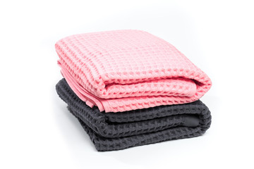 Colorful stacked bath towels isolated on white background. - Image