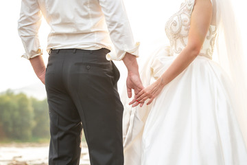 Wedding couple holding hands. Wedding card. couple shooting for photo album