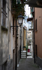 Fototapeta premium Narrow alley between historic houses in Colonnata