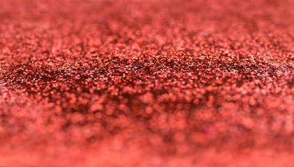 Blur red sparkle background. Defocused christmas texture.