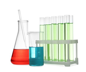 Different laboratory glassware with color liquid isolated on white