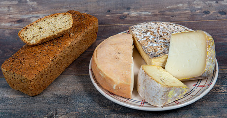 cheeses and Tomme de Savoie, bread, French cheese Savoy, french Alps.