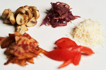 Traditional breakfast omelette with bacon, tomatoes, mushrooms, onion