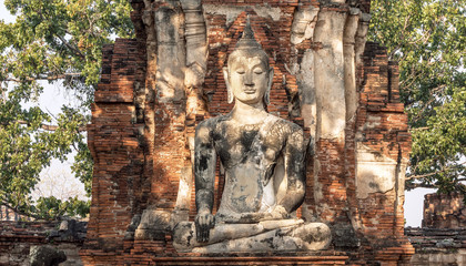 Ancient Buddha statue at sunrise in Ayutthaya, Thailand