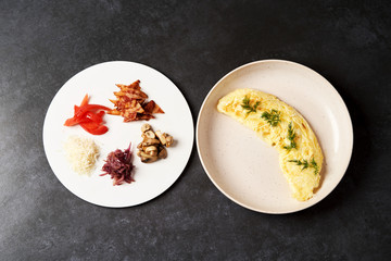 Traditional breakfast omelette with bacon, tomatoes, mushrooms, onion