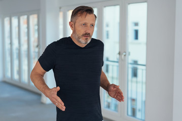 Middle-aged man running in place as warming up