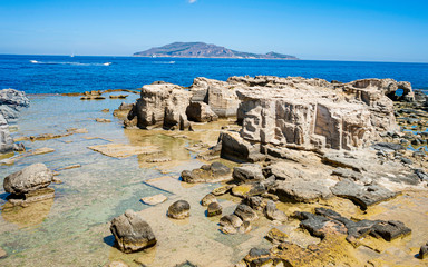 Fototapeta na wymiar Travel view of Aegadian Islands featuring Favignana sea rocks, island of Favignana province of trapani Sicily Italy