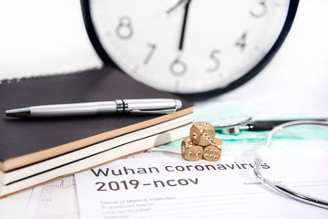 Medicine documents with golden game dices on it. Abstract photo of illness time.