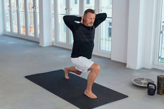 Man doing stretch and lunge exercises