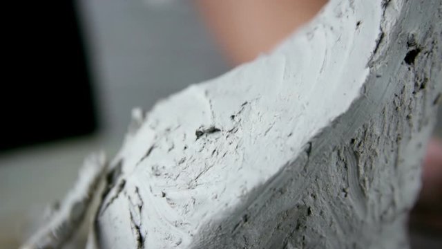 Sculptor is working on the creation of a monument