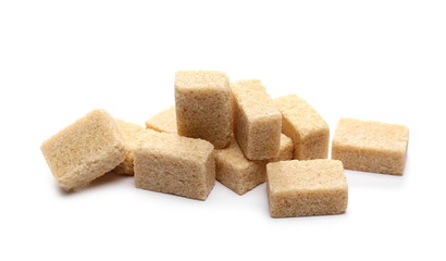 Brown cane sugar cubes isolated on white background
