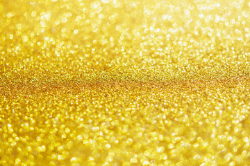 Abstract gold glitter sparkle with bokeh light background