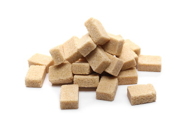 Brown cane sugar cubes isolated on white background