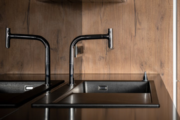 Close-up on kitchen faucet and sink