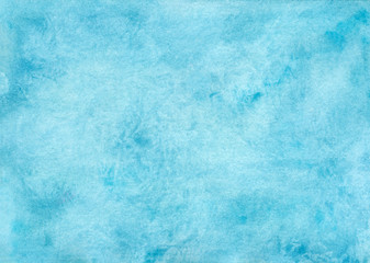 Abstract watercolor background in turquoise color with hand-drawn prints of paint.