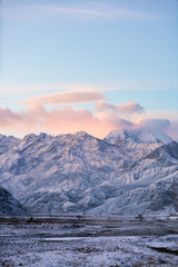 Xinjiang China Pamir Plateau snow mountain in winter. Sun rise morning landscape.