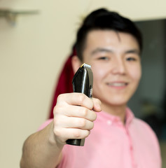 the guy with the hair-clipper in hand