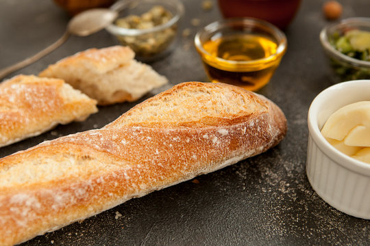 Freshly baked baguette. Long loaf, white wheat bread. French traditional cuisine. Bakery products.