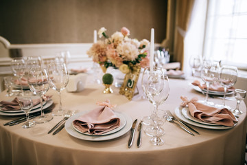 elegant table setting for a wedding banquet, pastel beige decorations