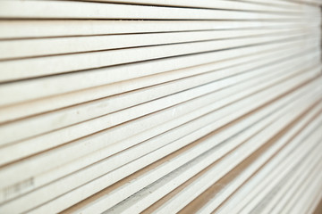 photo of a stack of drywall from close range
