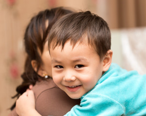 boy with mother cuddling
