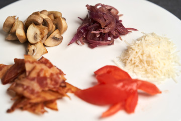 Traditional breakfast omelette with bacon, tomatoes, mushrooms, onion