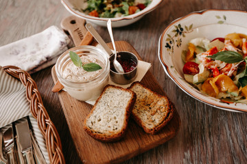 Pate on a wooden board and toast