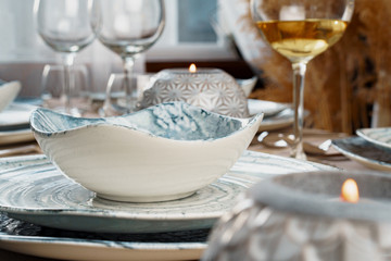 Table setting with stylish dishware on beige tablecloth
