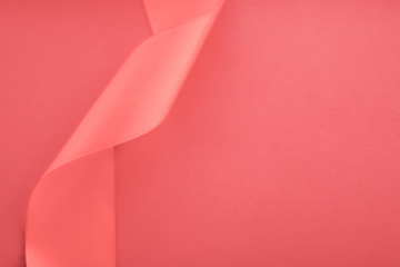 Abstract curly silk ribbon on coral background, exclusive luxury brand design for holiday sale...