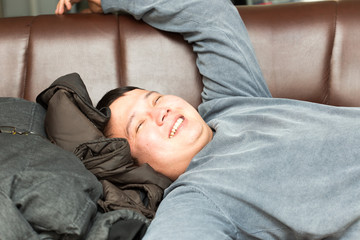 man sleeping on the couch