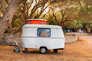 Little caravan with orange open roof