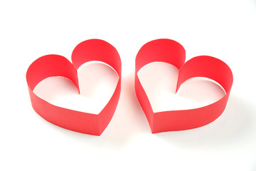Couple of red paper hearts on white background isolated